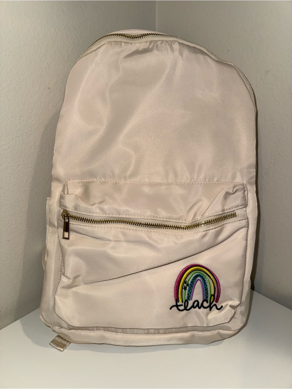 TEACH Cream Backpack with Rainbow 'Teach' Patch
